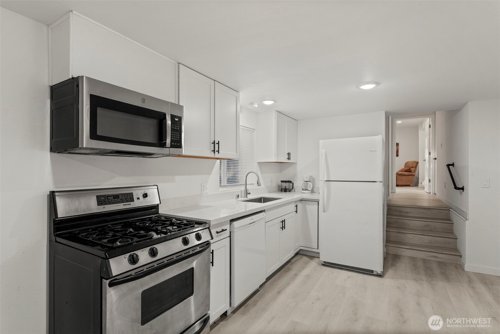 13405 Southeast 56th Place Bellevue, WA 98006 - Photo 30 of 38 a kitchen with a stove and a microwave
