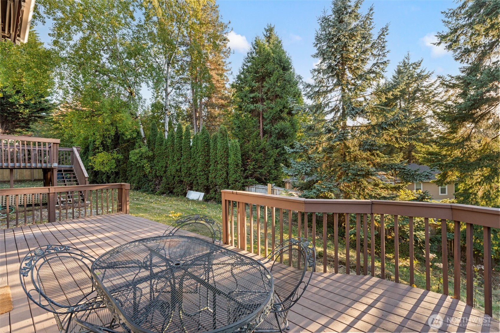 13405 Southeast 56th Place Bellevue, WA 98006 - Photo 33 of 38 a view of balcony with wooden floor and outdoor seating