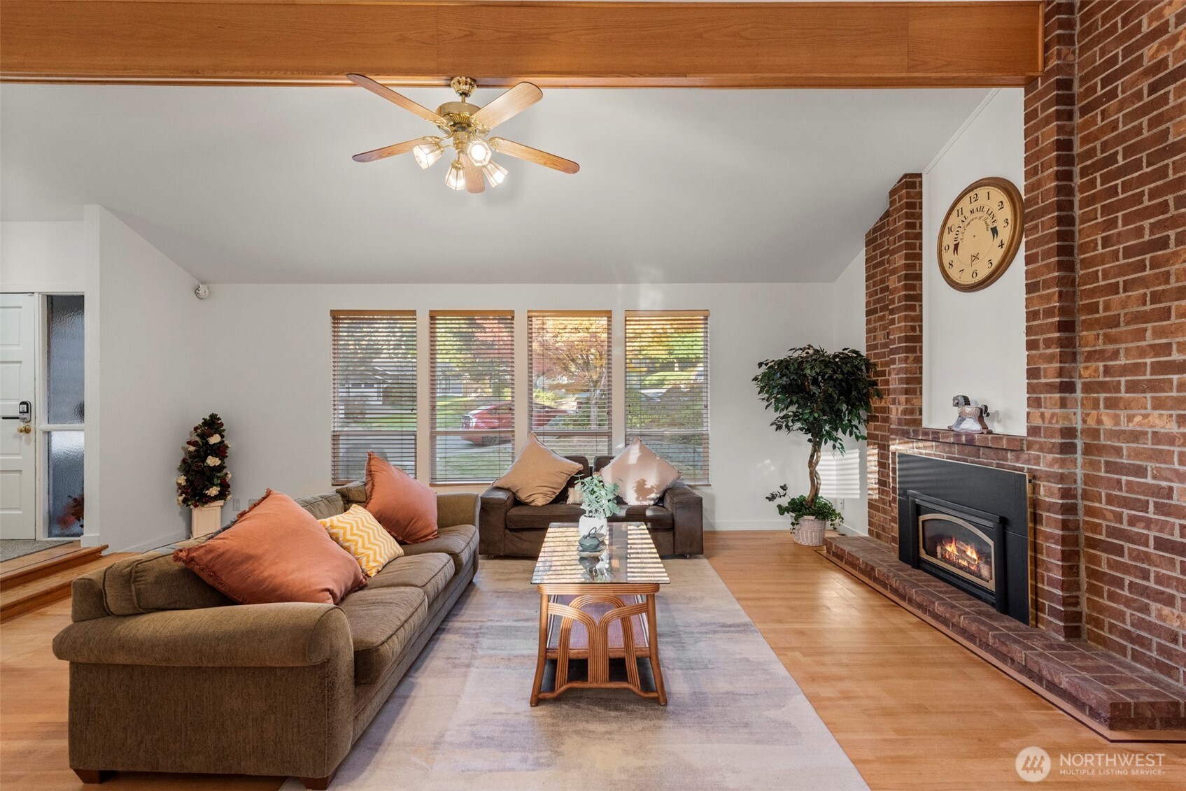 13405 Southeast 56th Place Bellevue, WA 98006 - Photo 7 of 38 a living room with furniture and a fireplace