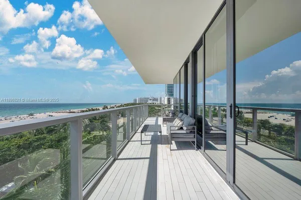a view of balcony with furniture