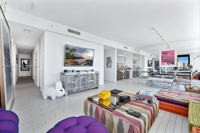 a living room with furniture and a rug