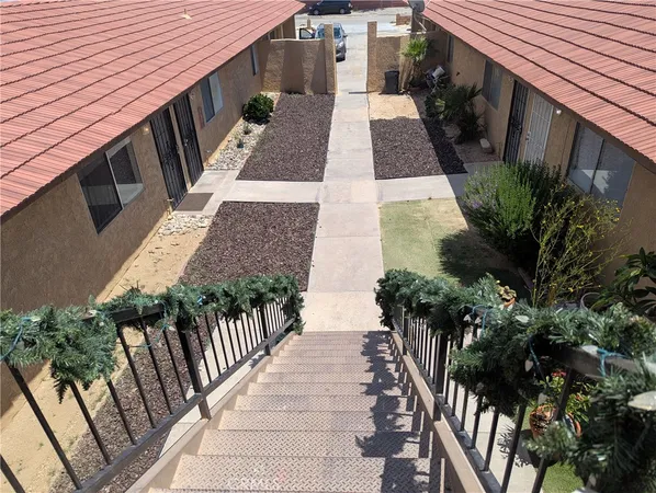 a view of a backyard with sitting area