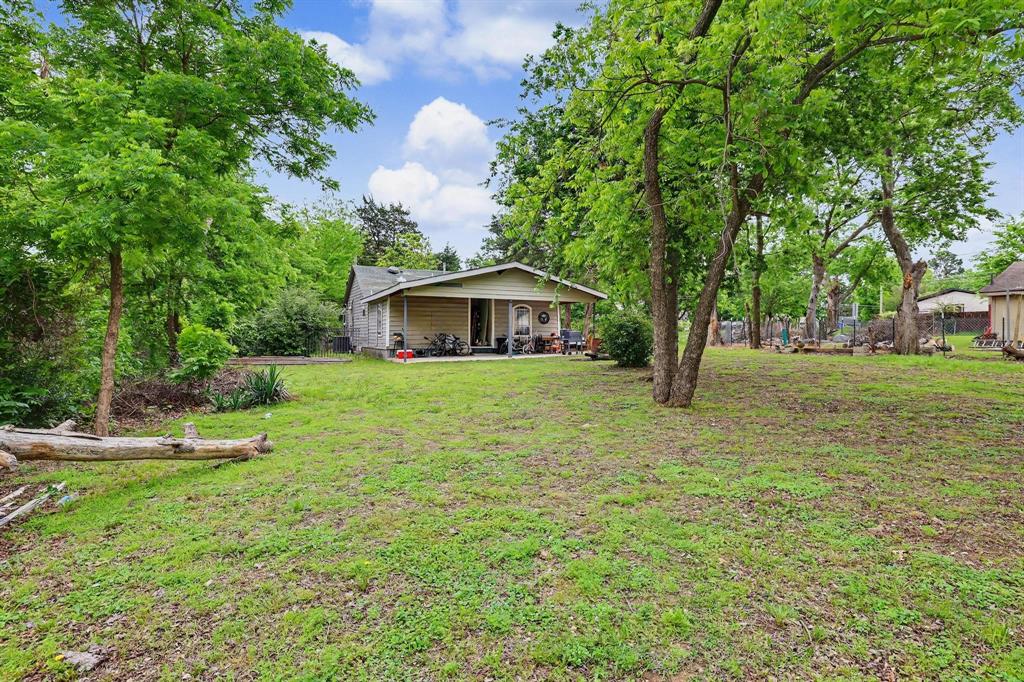 205 South Main Street Bonham, TX 75418 - Photo 22 of 23 a front view of a house with garden