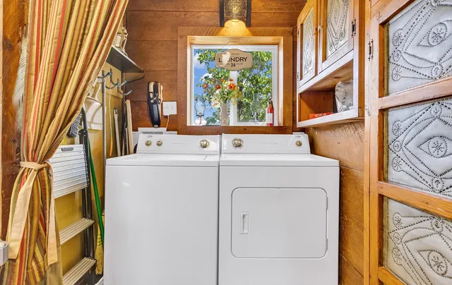 a bed sitting in a spacious bedroom next to a window
