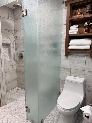 a bathroom with a toilet and a sink