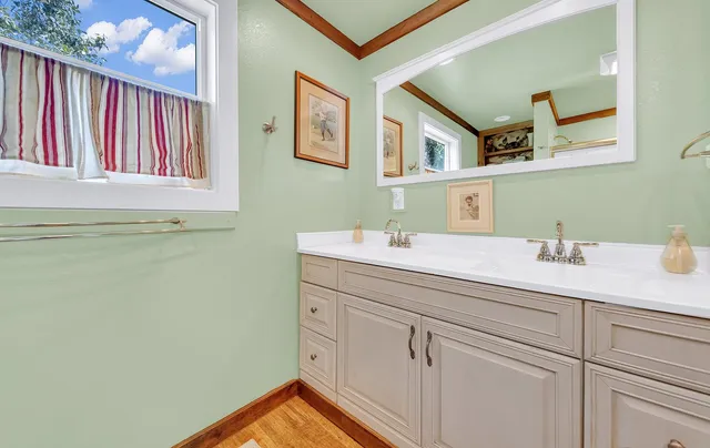 a bed room with two bed and a lamp