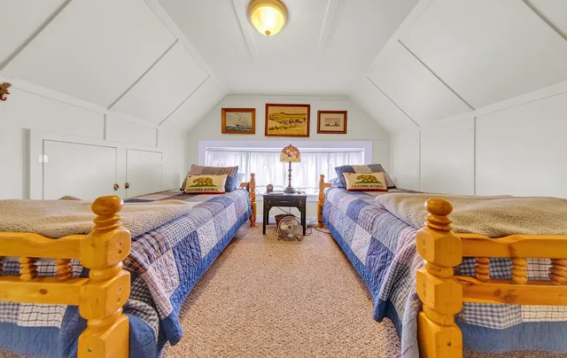 a bed room with a bed and a lamp