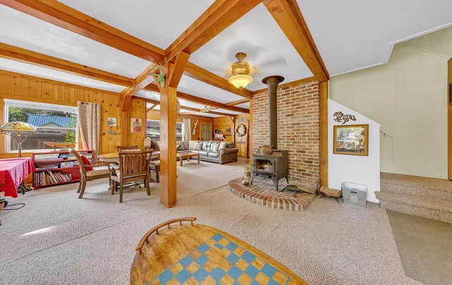 a view of a livingroom with furniture and a fireplace