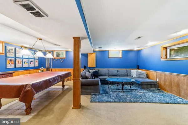 a living room with furniture and a rug