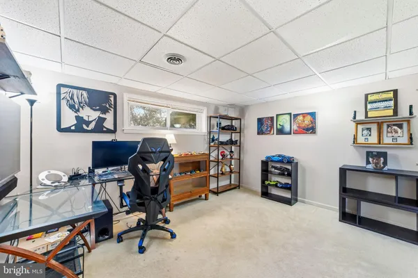a view of a workspace with furniture