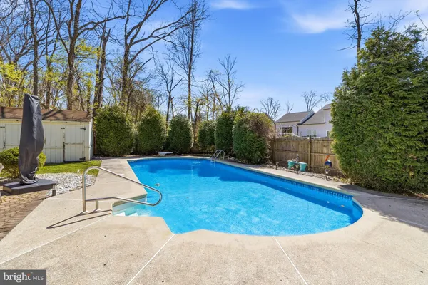 a view of a swimming pool with a yard