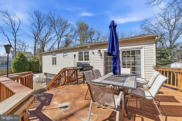 a view of a patio with a table and chairs and couches