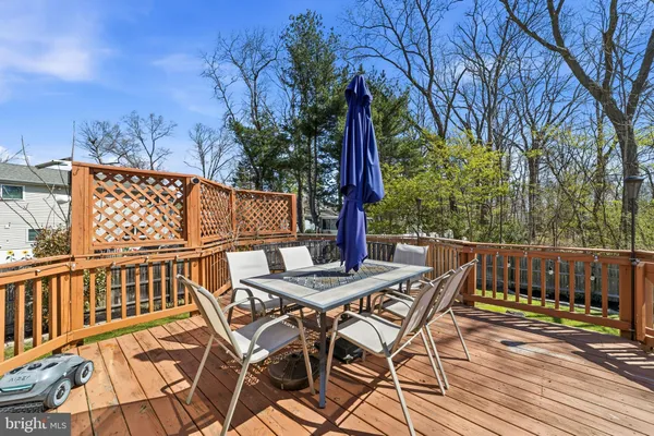a view of a chairs and table on the deck