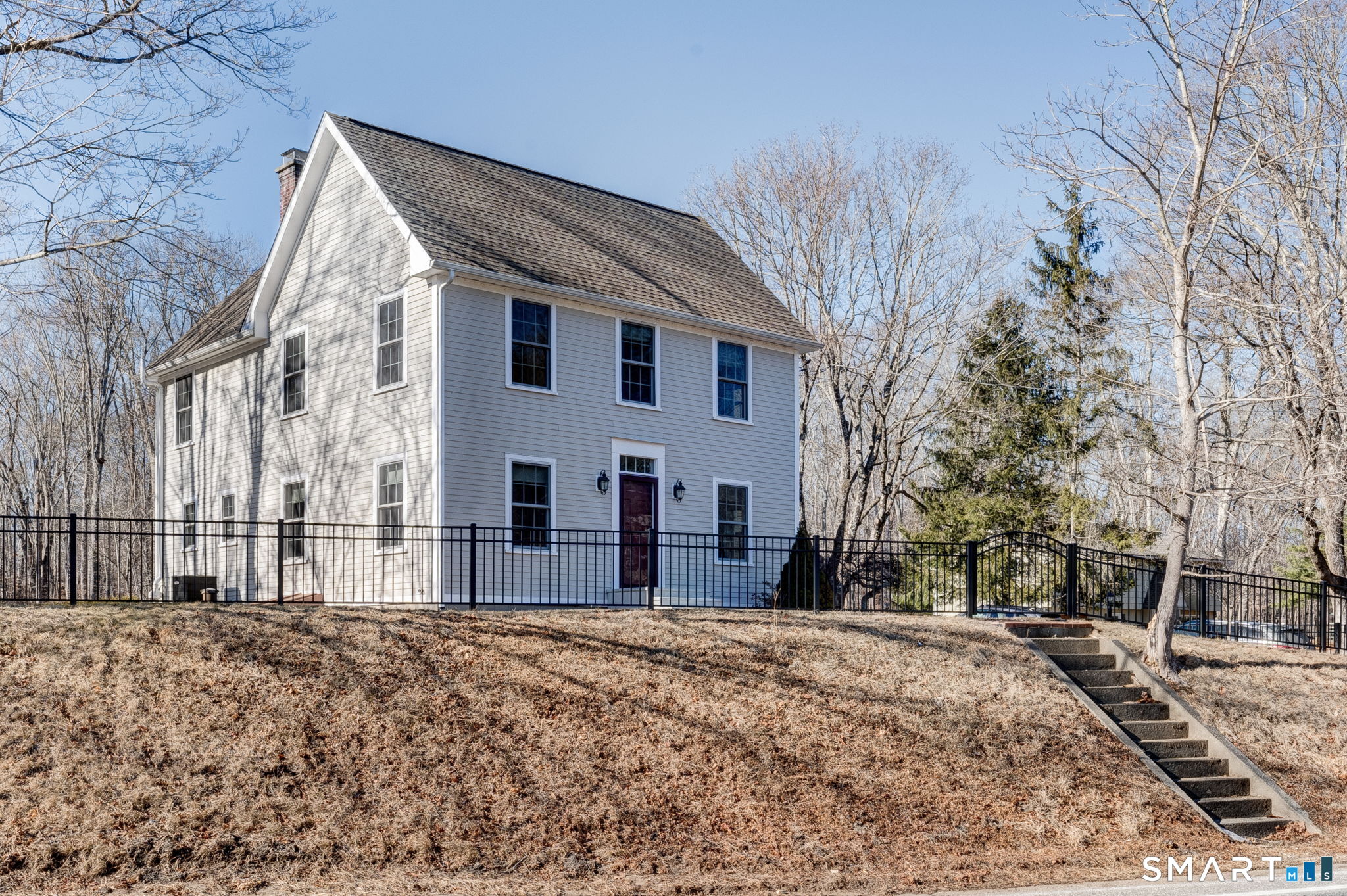 353 Warrenville Road Mansfield, CT 06250 - Photo 1 of 40 a view of a house with a snow on the road