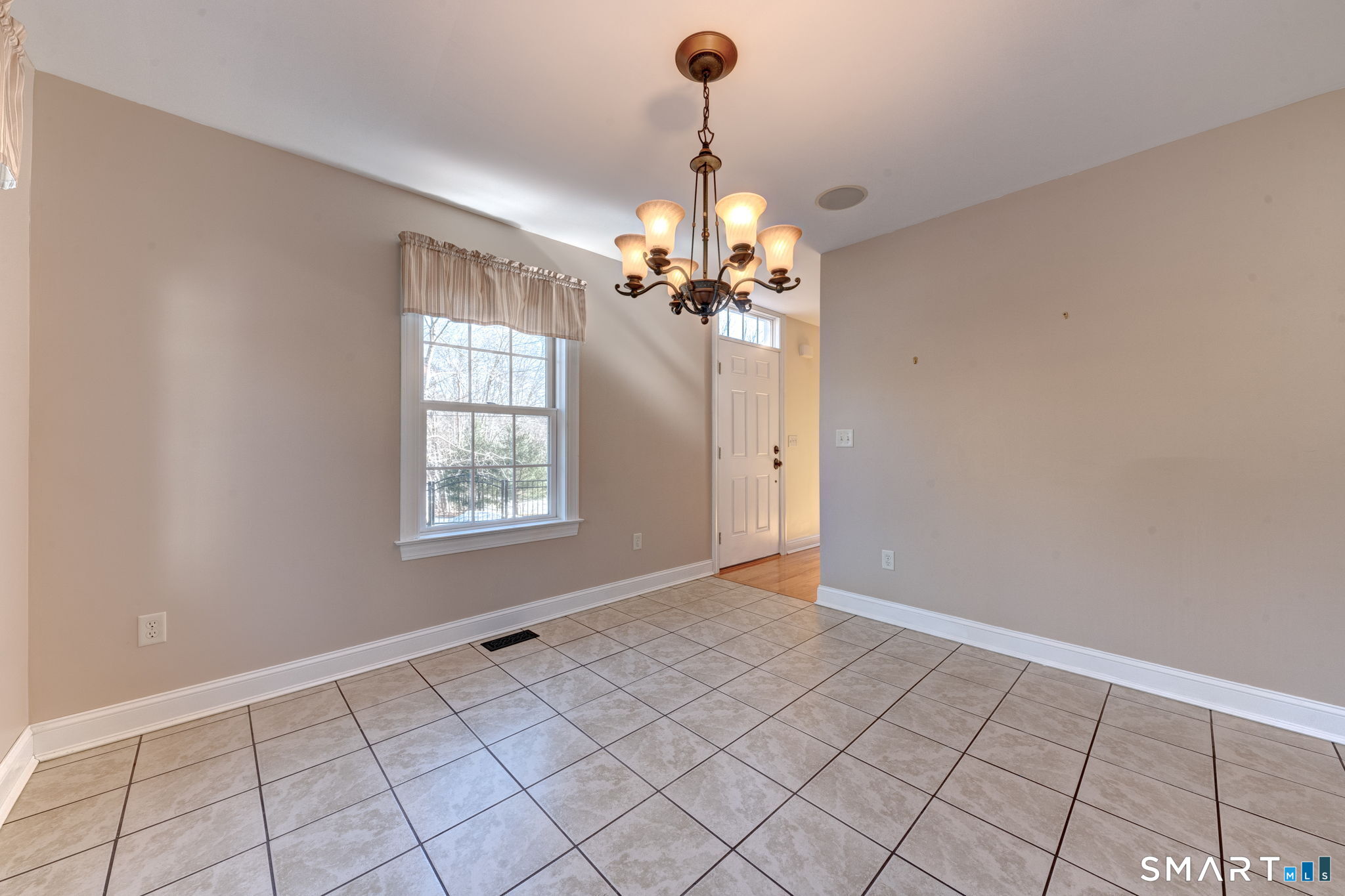 353 Warrenville Road Mansfield, CT 06250 - Photo 13 of 40 a view of an empty room with a window