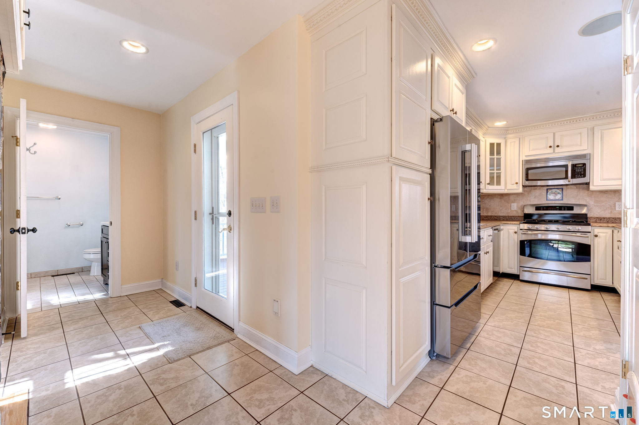 353 Warrenville Road Mansfield, CT 06250 - Photo 20 of 40 a kitchen with stainless steel appliances a refrigerator and a stove top oven