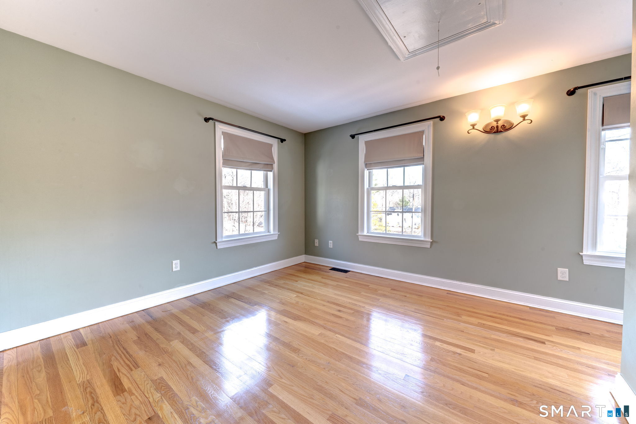 353 Warrenville Road Mansfield, CT 06250 - Photo 30 of 40 a view of an empty room with wooden floor and a window