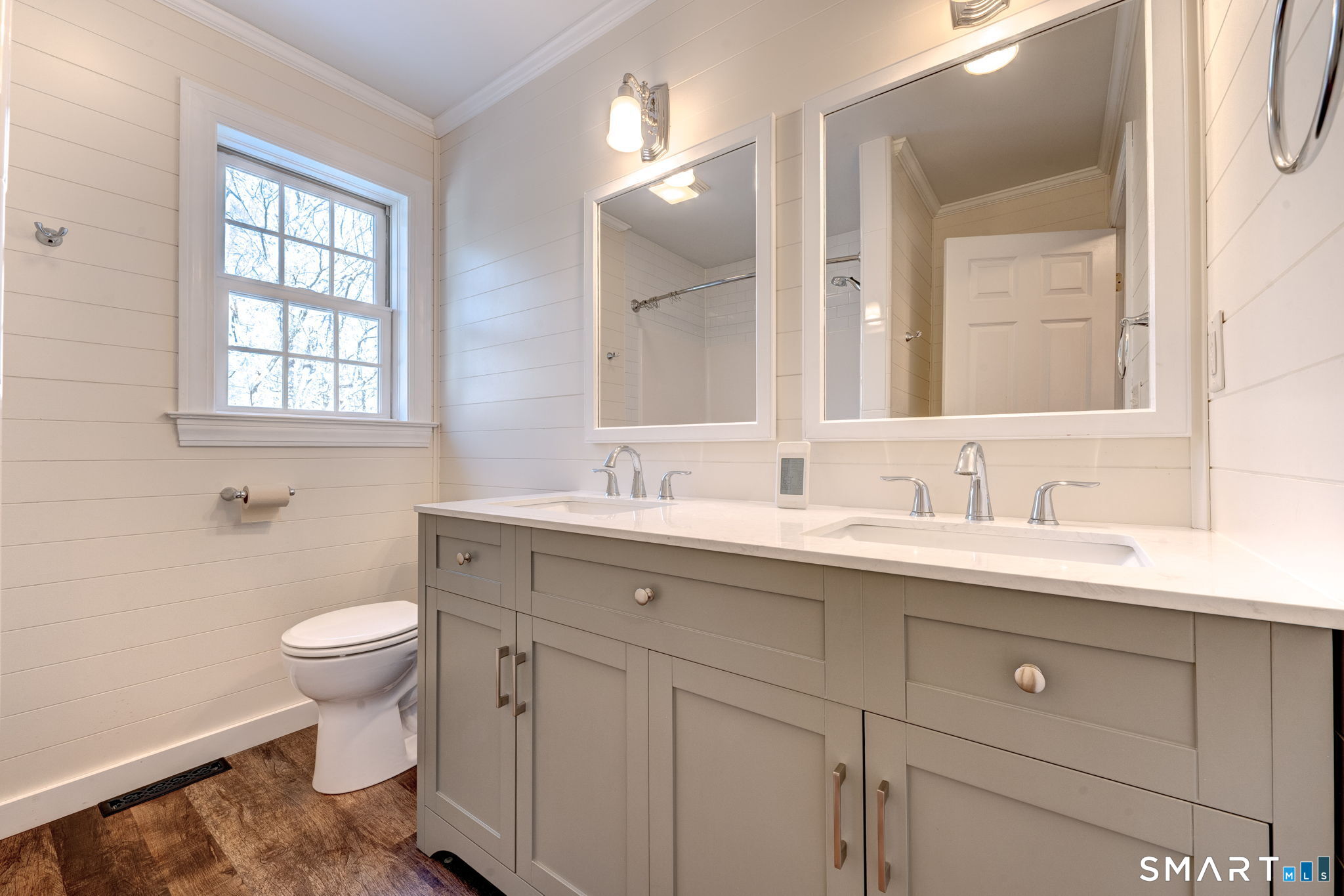 353 Warrenville Road Mansfield, CT 06250 - Photo 32 of 40 a bathroom with a toilet a sink a mirror a and a window