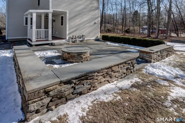 a view of a house with wooden fence