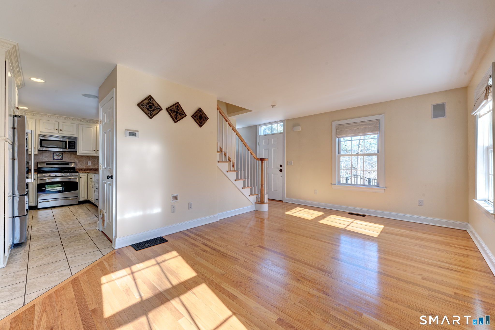 353 Warrenville Road Mansfield, CT 06250 - Photo 10 of 40 wooden floor in an empty room with a window