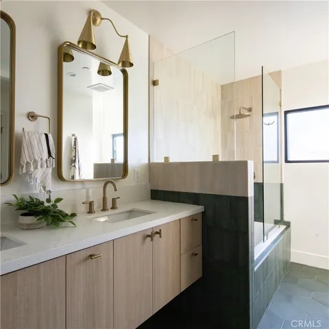 a bedroom with a bed and ceiling fan