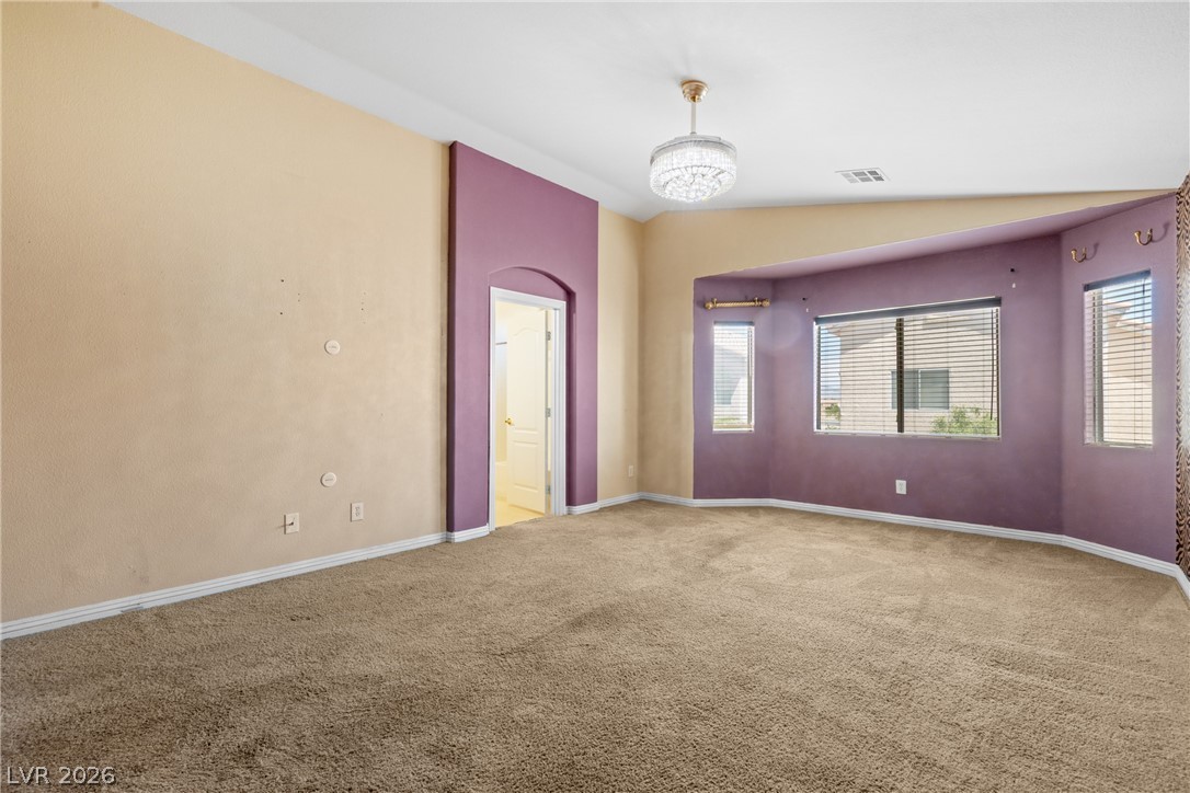 8934 Deep Ridge Court Las Vegas, NV 89178 - Photo 22 of 47 A spacious room offers comfortable carpeted flooring and ample natural illumination through numerous windows.