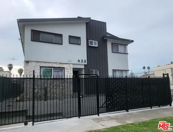a front view of a house with parking space