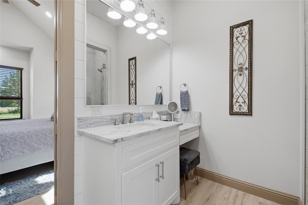 958 Cedar Mills Road Gordonville, TX 76245 - Photo 19 of 40 a bathroom with a sink and a mirror