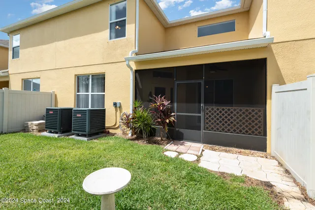 a view of a bathroom with a shower and a window