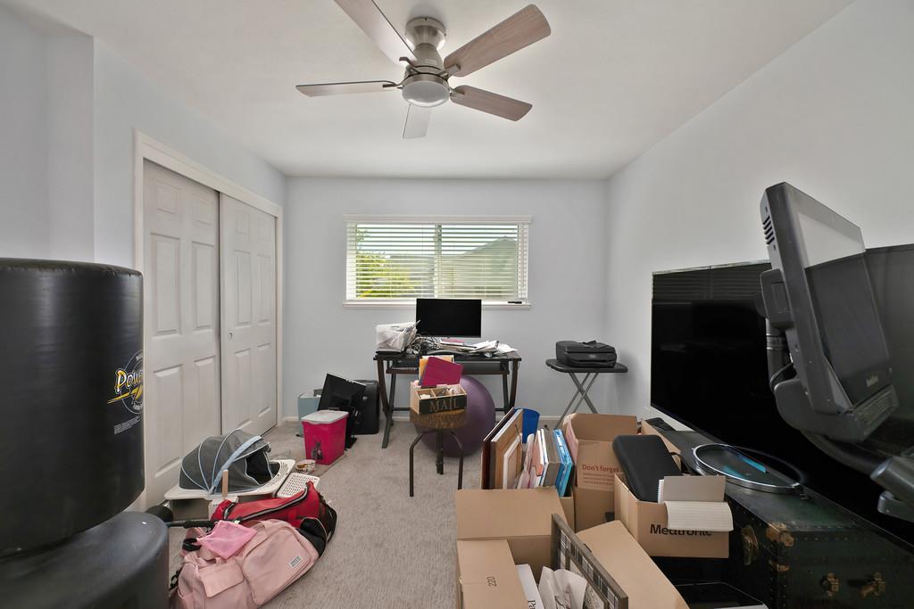 3641 Catlett Road Pleasant Grove, CA 95668 - Photo 11 of 29 a living room with furniture and a flat screen tv