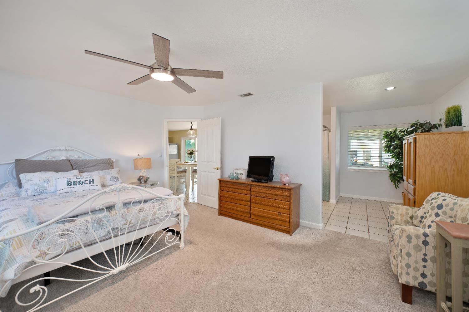3641 Catlett Road Pleasant Grove, CA 95668 - Photo 12 of 29 a bedroom with a bed and a flat screen tv