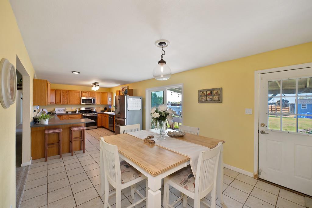 3641 Catlett Road Pleasant Grove, CA 95668 - Photo 17 of 29 a view of a dining room with furniture and a kitchen