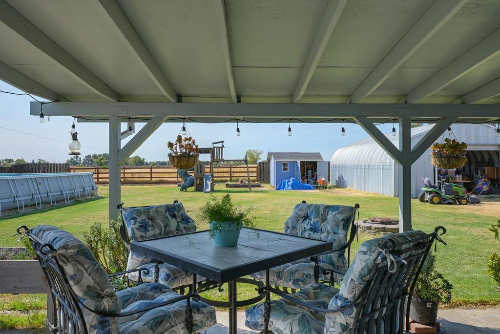 3641 Catlett Road Pleasant Grove, CA 95668 - Photo 24 of 29 a view of a swimming pool and a table in the patio