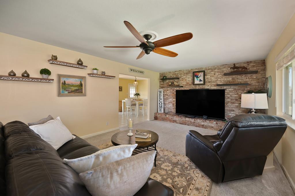 3641 Catlett Road Pleasant Grove, CA 95668 - Photo 4 of 29 a living room with furniture and a flat screen tv