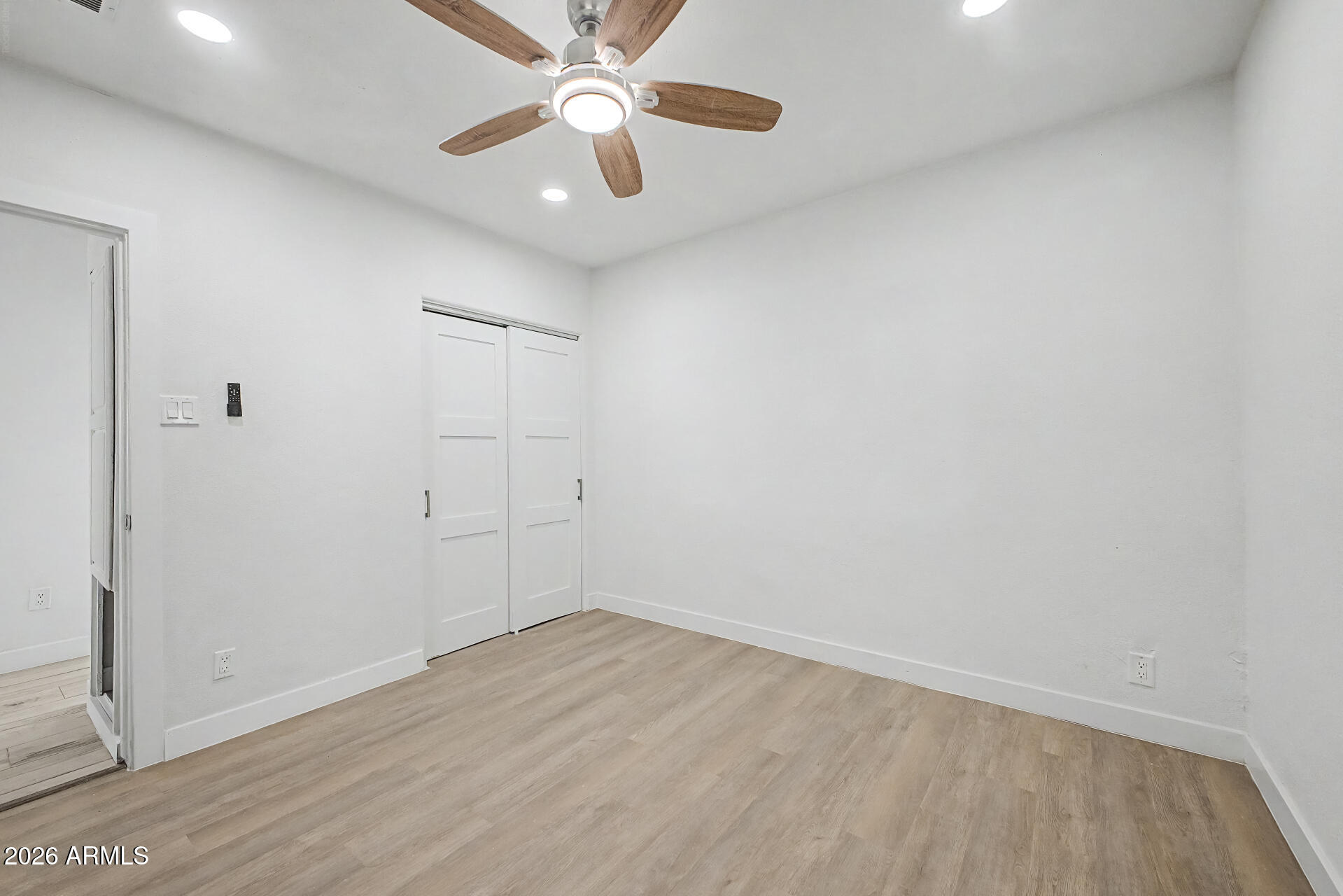 532 East Cheery Lynn Road Phoenix, AZ 85014 - Photo 21 of 37 an empty room with a window and a ceiling fan