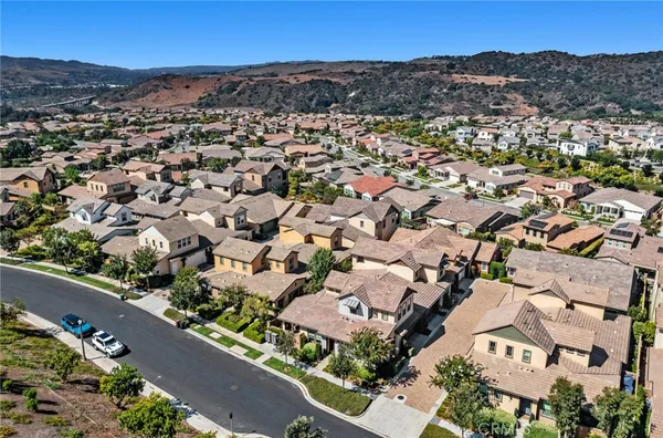 an aerial view of residential houses with outdoor space