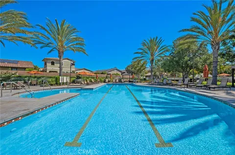 a view of swimming pool with outdoor seating and yard