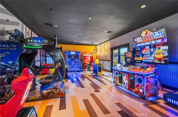 a living room with lots of furniture and clutter