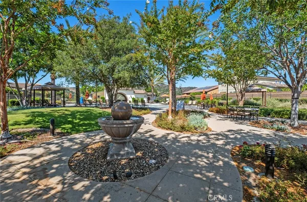 a view of a swimming pool with a lounge chair