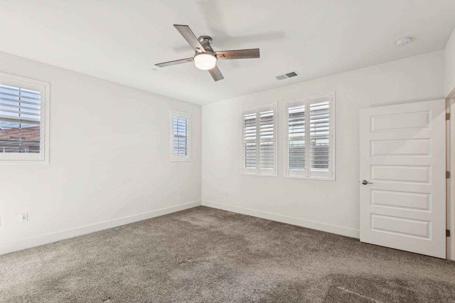 10458 Oboe Way Elk Grove, CA 95757 - Photo 20 of 38 a view of an empty room with a window