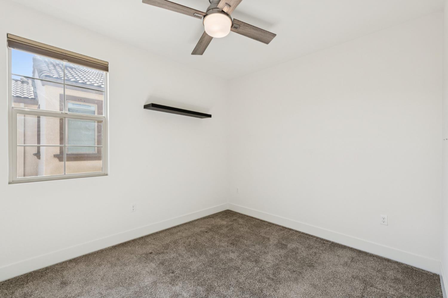 10458 Oboe Way Elk Grove, CA 95757 - Photo 26 of 38 an empty room with a window