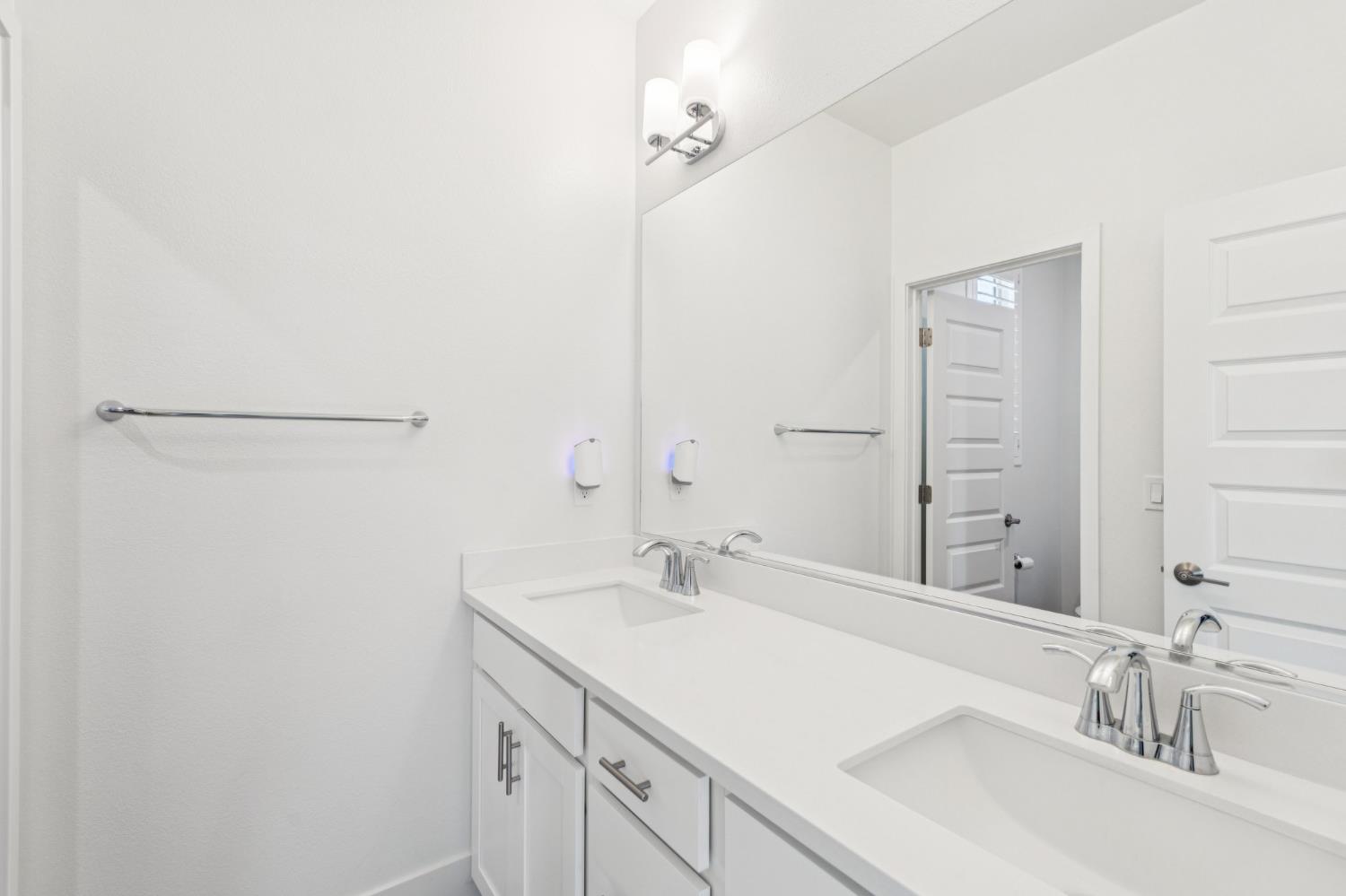 10458 Oboe Way Elk Grove, CA 95757 - Photo 32 of 38 a bathroom with a sink and a mirror