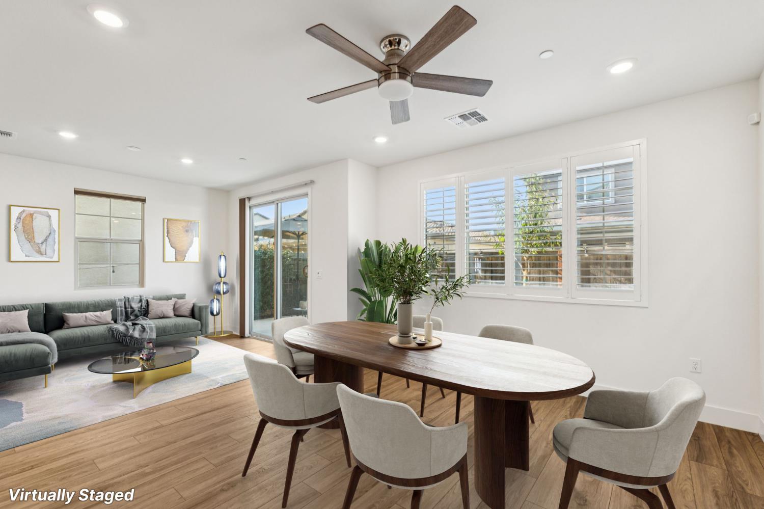 10458 Oboe Way Elk Grove, CA 95757 - Photo 8 of 38 a dining room with furniture a chandelier and wooden floor