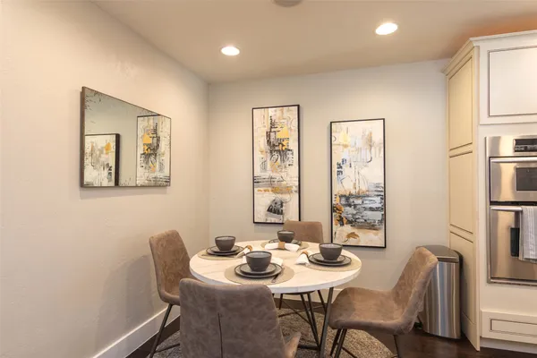 a view of a dining room with furniture and window