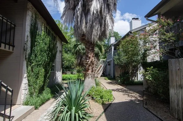 a backyard of a house with lots of green space