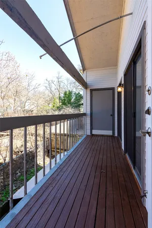 a view of balcony with wooden floor