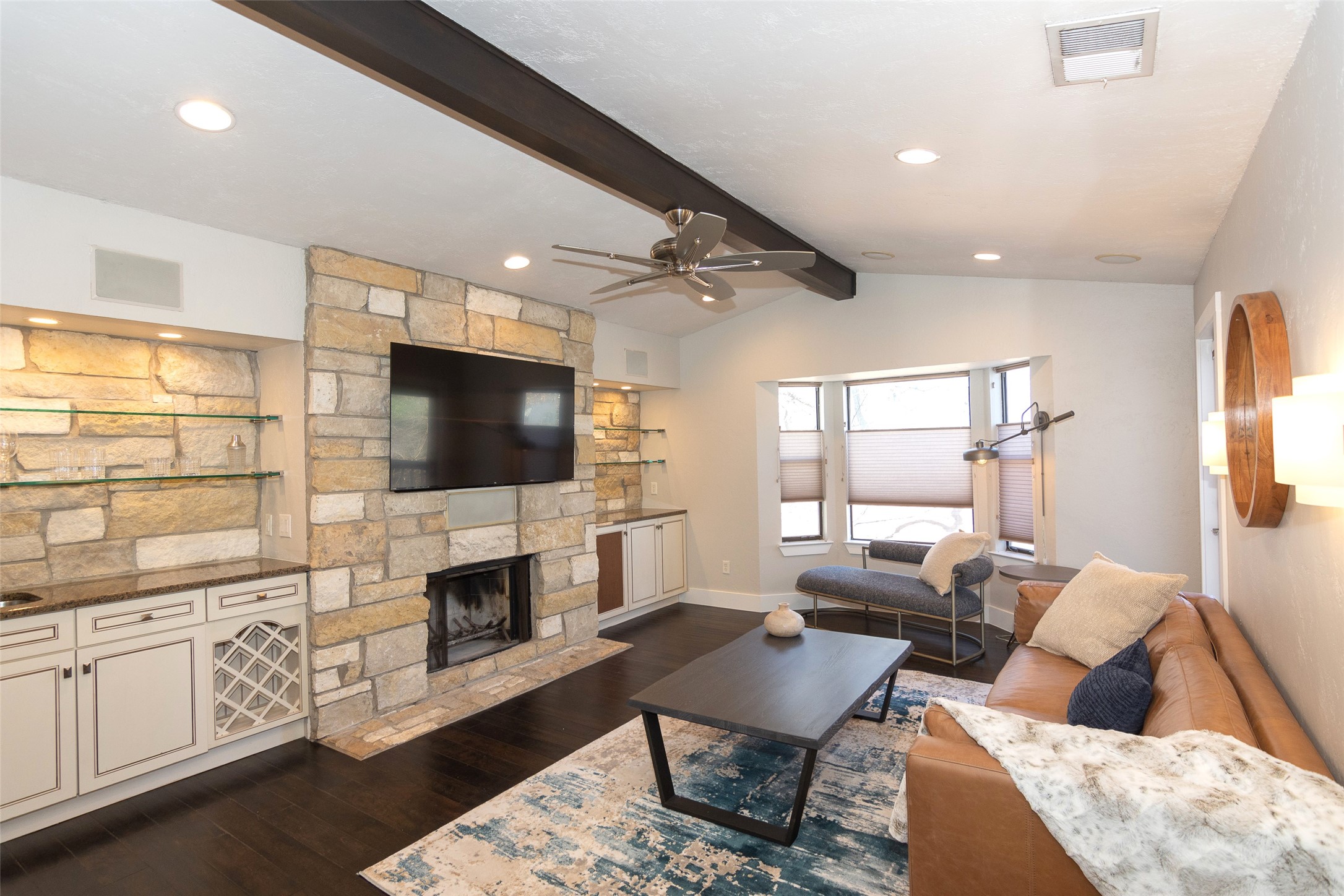 2410 Enfield Road, Unit 10 Austin, TX 78703 - Photo 7 of 40 a living room with furniture a flat screen tv and a fireplace