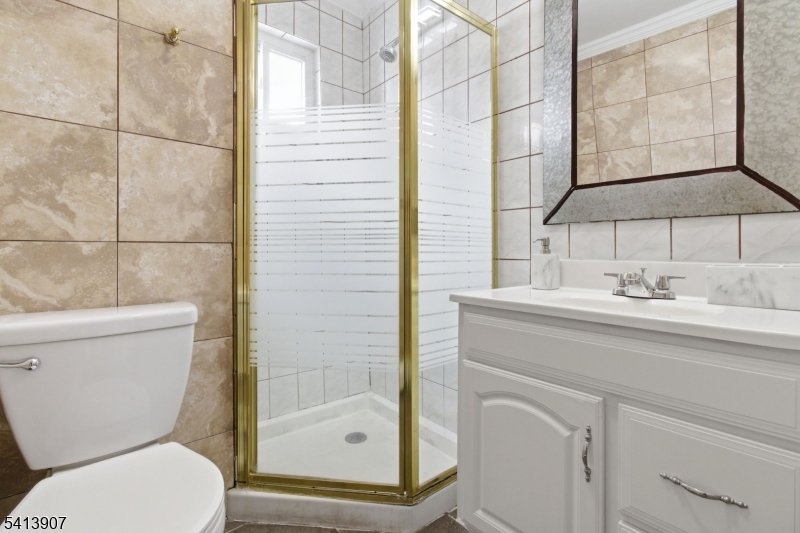 32 Cedar Avenue Elizabeth, NJ 07202 - Photo 26 of 32 a bathroom with a toilet sink and shower