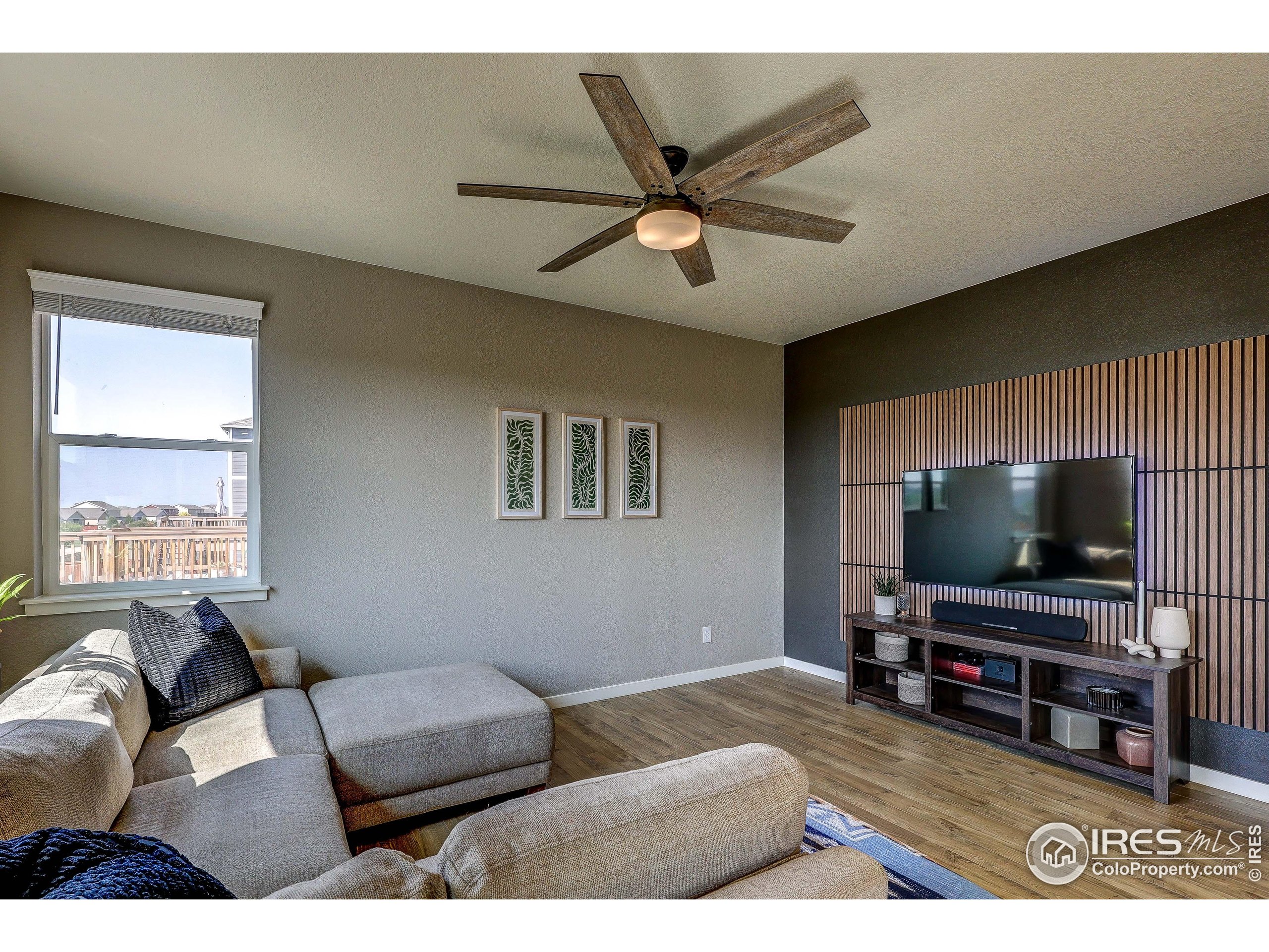 1335 Copeland Falls Road Severance, CO 80550 - Photo 16 of 40 a living room with furniture and a flat screen tv