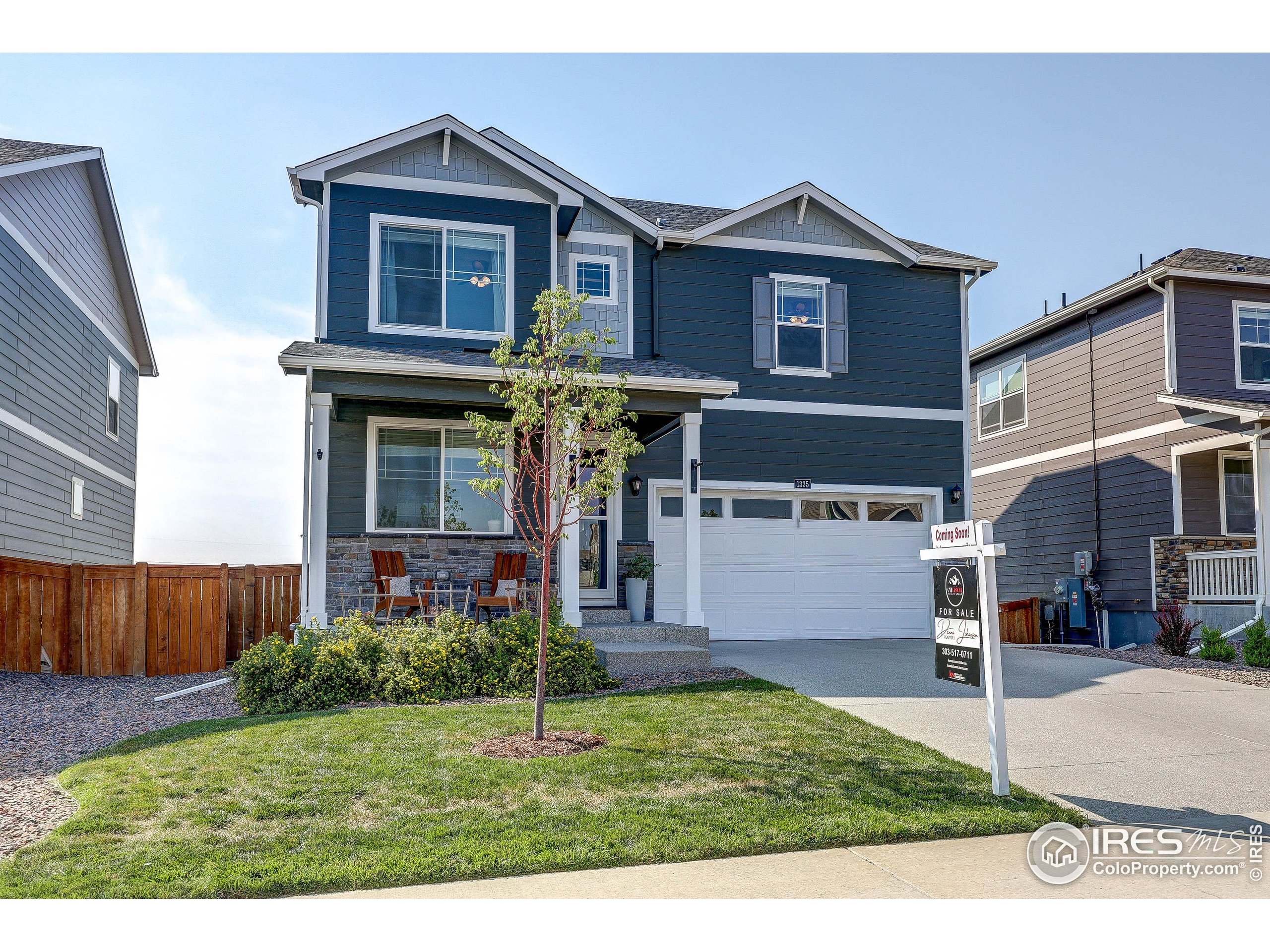 1335 Copeland Falls Road Severance, CO 80550 - Photo 2 of 40 a front view of a house with a yard and garage
